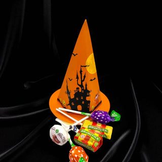 Halloween-themed candy cone with lollipops and boxes on a black background