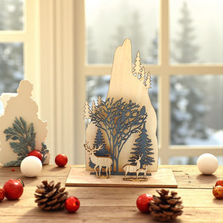 Wooden decorative piece with cut-out trees and deer on a table with Christmas ornaments. Woodlands, Nordic Aesthetic