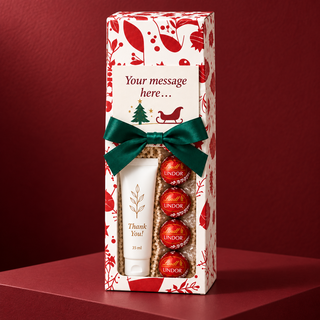 Personalised corporate Christmas hand cream and Lindt Lindor gift box on a red festive backdrop