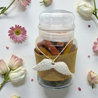 Dried fruit snack gift shaped like wings with elegant packaging on a white background