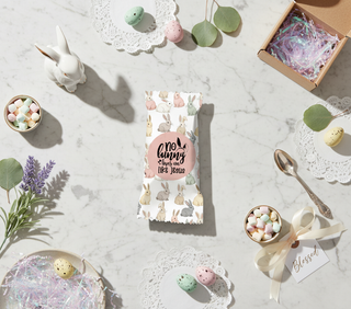 Easter-themed package with candy on a marble surface