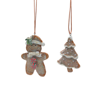 Two Christmas-themed ornaments: a gingerbread man and a tree, hanging on white background.