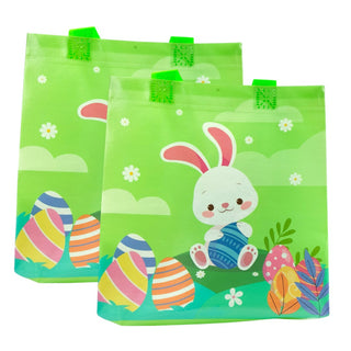 Two green Easter bags with bunny and egg designs on a white background