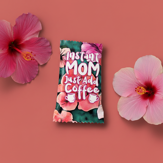 Floral-themed instant coffee package with pink flowers on a pink background