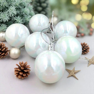 Iridescent Christmas ornaments with pine cones and a star on a festive background