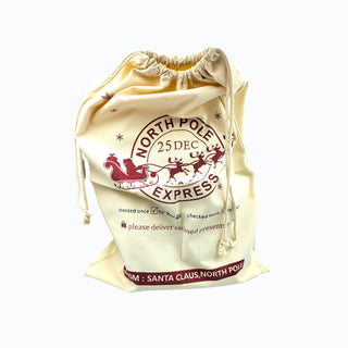 Beige drawstring bag with 'North Pole Express' text and Santa Claus design on a white background