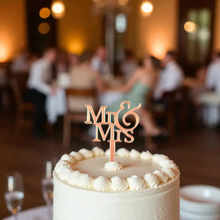 Elegant Mr and Mrs cake topper in wood finish with heart design on white cake