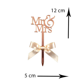 Elegant Mr and Mrs cake topper in wood finish with heart design on a white background with dimensions