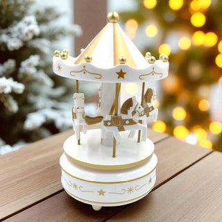 Decorative carousel toy on a wooden surface with a festive background