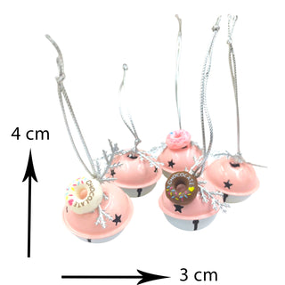 Pink donut-shaped charms with decorative elements on strings, showing measurements.