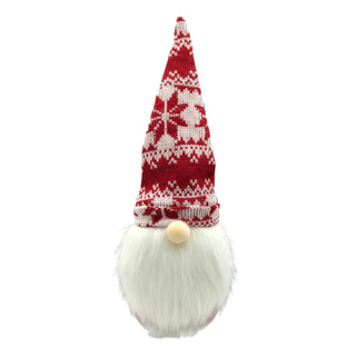 Decorative gnome with a red and white patterned hat on a white background. Scandi norweigan cosy aesthetic