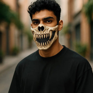 Person wearing a Halloween-themed skull mask with pumpkins and bats in the background