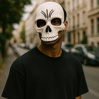 Person wearing a white skull mask on a city street