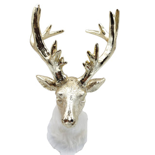 Decorative gold deer head mount on a white background .