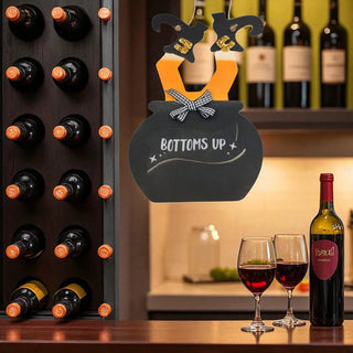 Bottoms Up' sign, and glasses in a cozy setting.