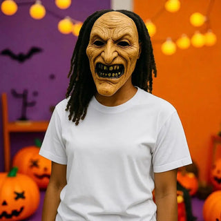 Person wearing a Halloween mask with pumpkins and decorations in the background